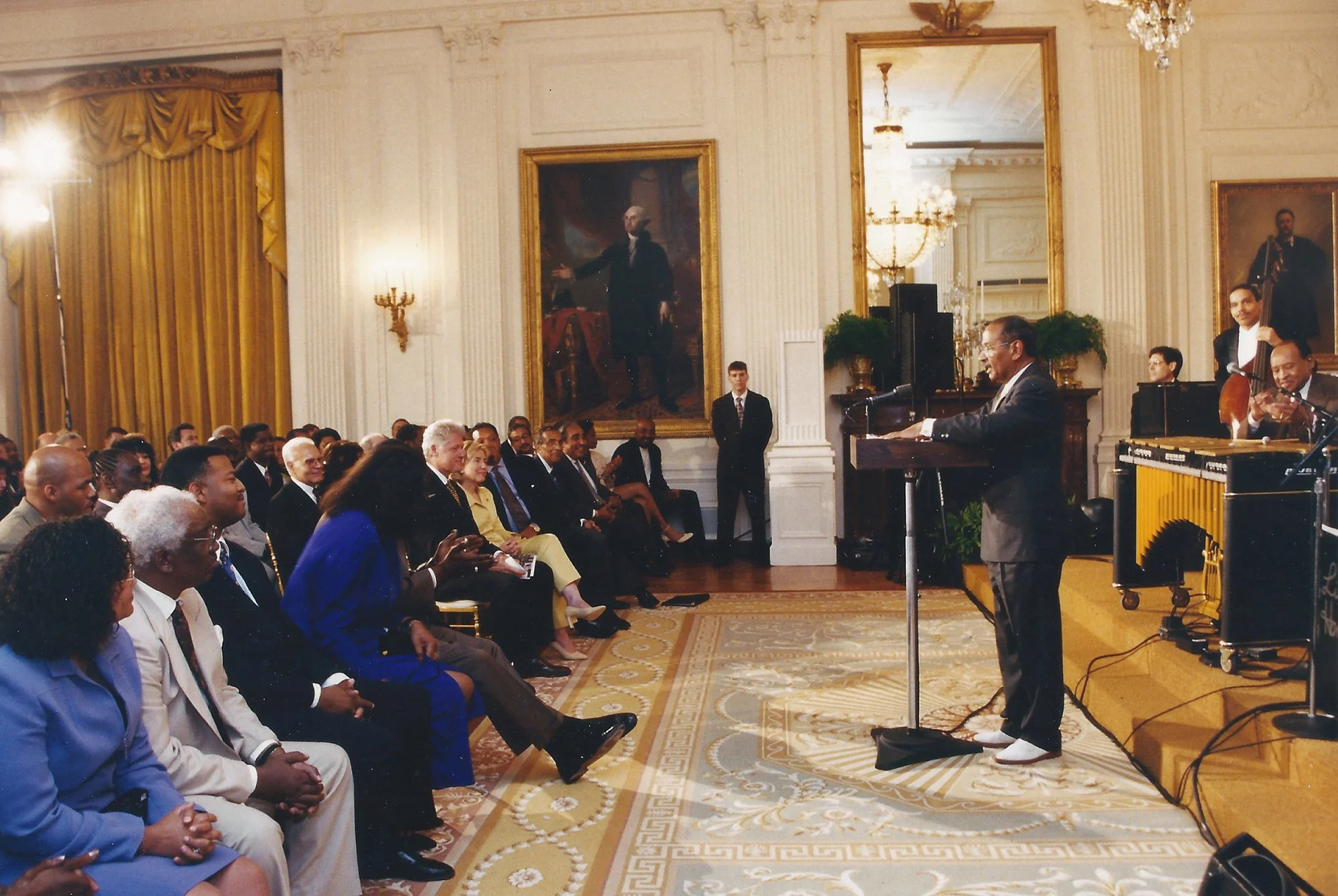 John Conyers Jr. speaking at the White House with President Bill Clinton, Jazz Legend Lionel Hampton, bassist Leon Lee Dorsey, and Jazz Legend Max Roach
